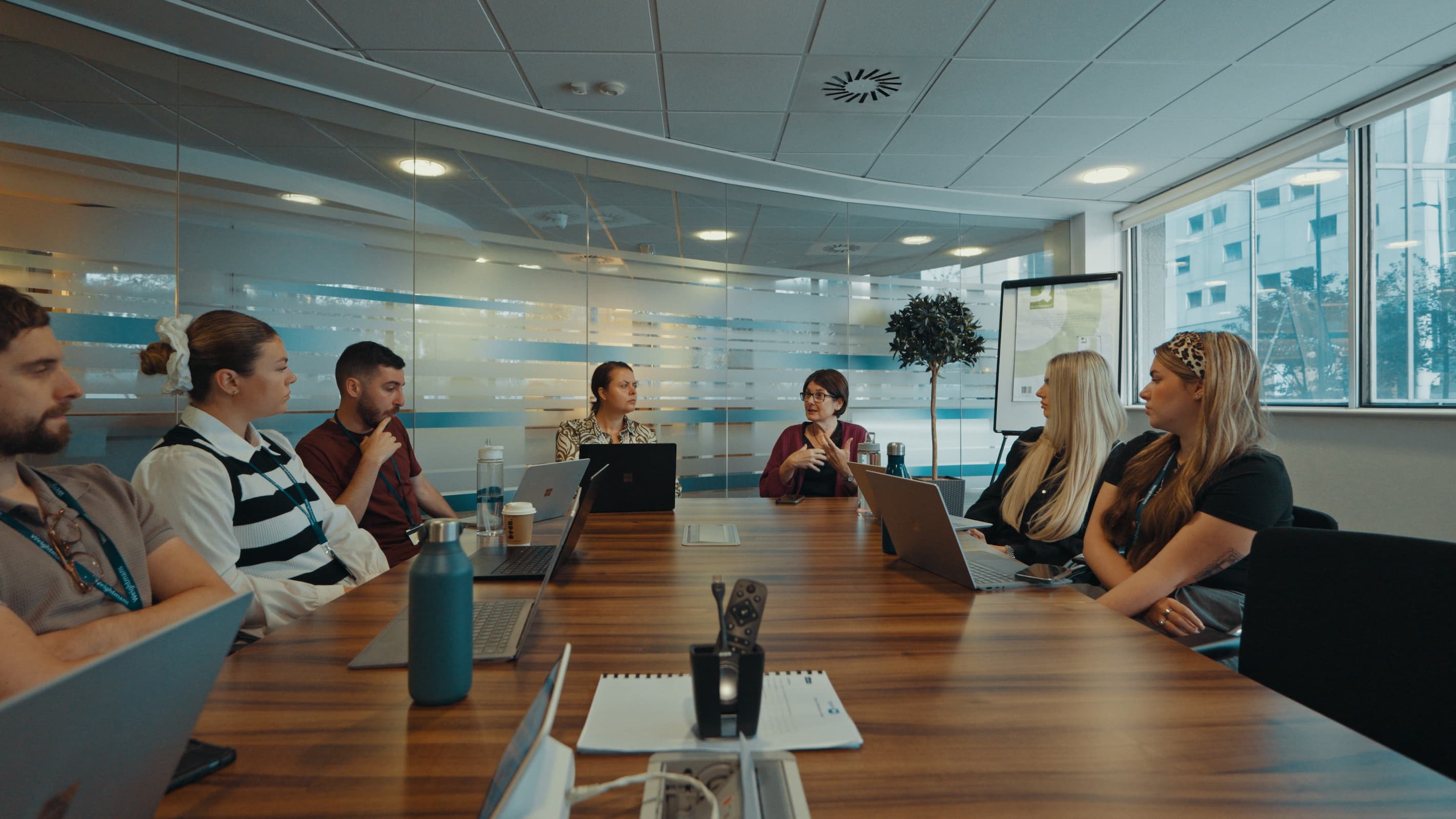 Colleagues sitting round a table 