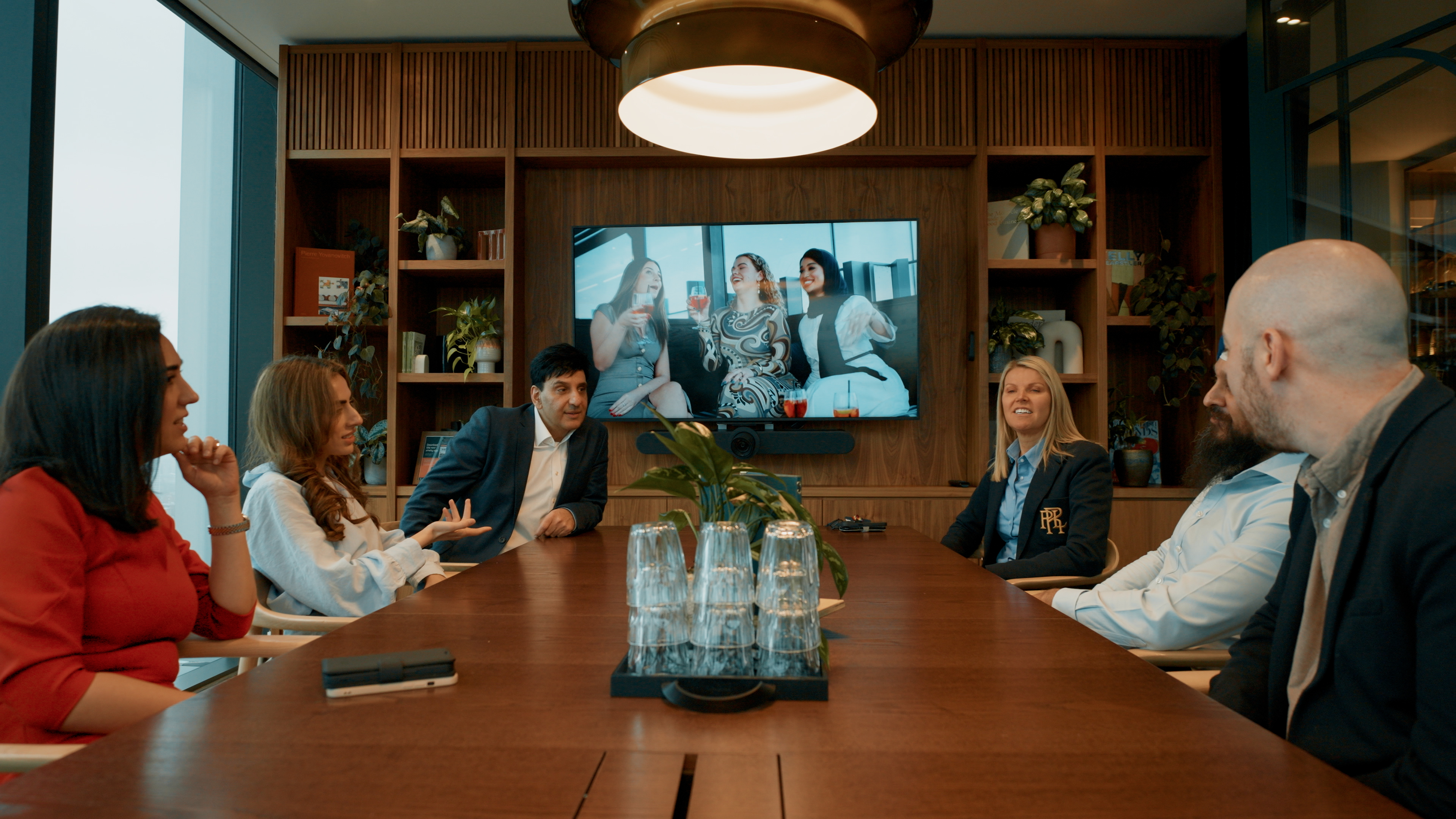 Colleagues sitting round a table 