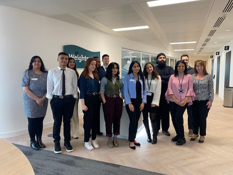 Members of the Weightmans team pose with visitors to the Birmingham office